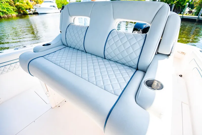Slide: The Image of Luxurious seating on a 2018 Intrepid 327 Center Console boat, featuring quilted upholstery. - 25