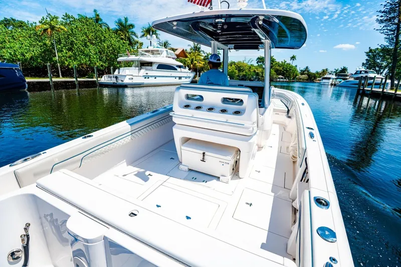 Slide: The Image of 2018 Intrepid 327 Center Console cruising on a scenic waterway. - 36