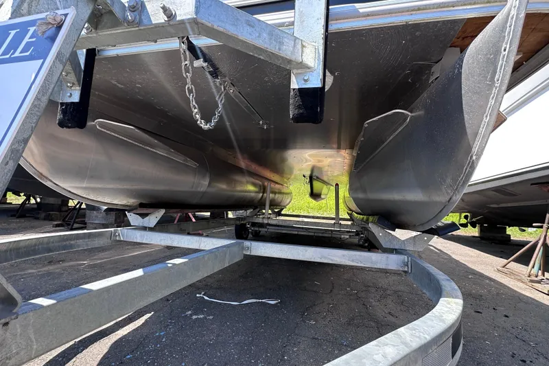 Slide: The Image of Underneath view of a 2022 Sylvan L1 CRS pontoon boat on a trailer. - 17