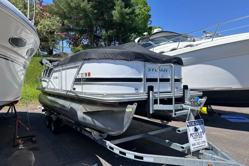Slide: The Image of 2022 Sylvan L1 CRS pontoon boat on trailer, for sale at Petzold's Yacht Sales. - 19