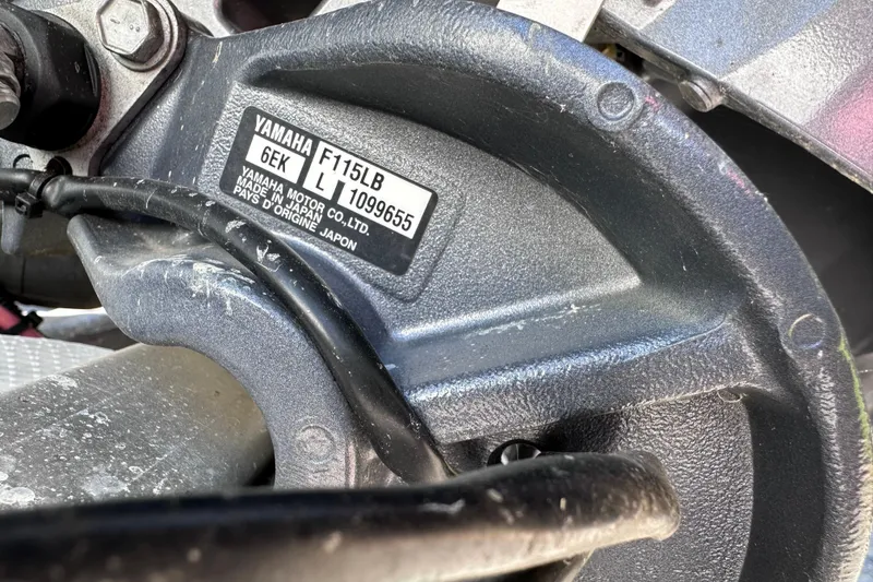 Slide: The Image of Close-up of a Yamaha F115LB engine part on a 2022 Sylvan L1 CRS boat. - 22