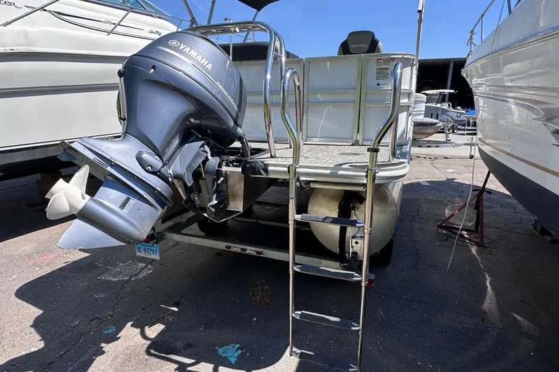 Slide: The Image of 2022 Sylvan L1 CRS boat with Yamaha outboard motor and boarding ladder. - 5