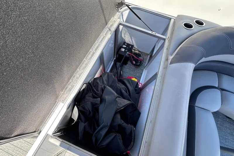 Slide: The Image of Storage compartment in 2022 Sylvan L1 CRS boat with seating and equipment. - 9