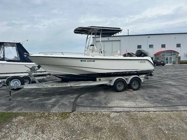 The Image of 2004 Boston Whaler OUTRAGE on trailer outside warehouse. - 0