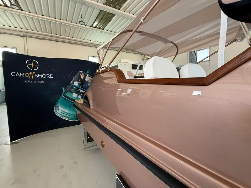 Slide: The Image of Rose gold Fiat 500 boat by Car Off-shore, 2026 model, in showroom. - 9