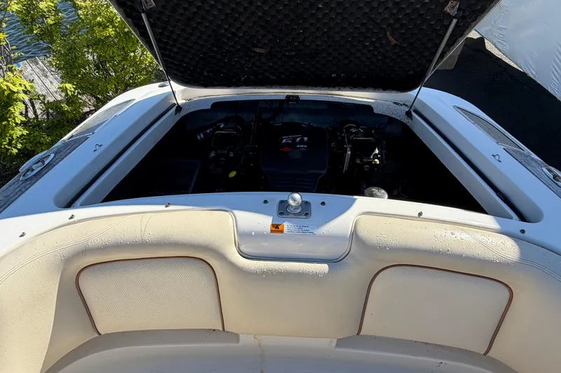 Slide: The Image of 2006 Chris-Craft Speedster engine compartment with open hatch, showcasing interior details. - 12