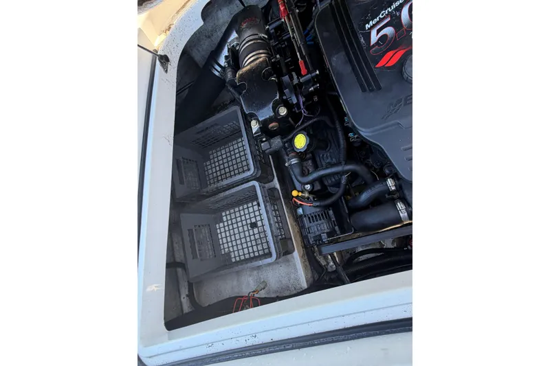 Slide: The Image of Engine compartment of a 2006 Chris-Craft Speedster boat with visible components. - 16