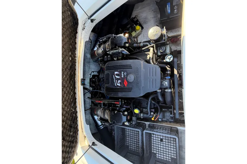 Slide: The Image of Engine compartment of a 2006 Chris-Craft Speedster boat, featuring a Mercury engine. - 17