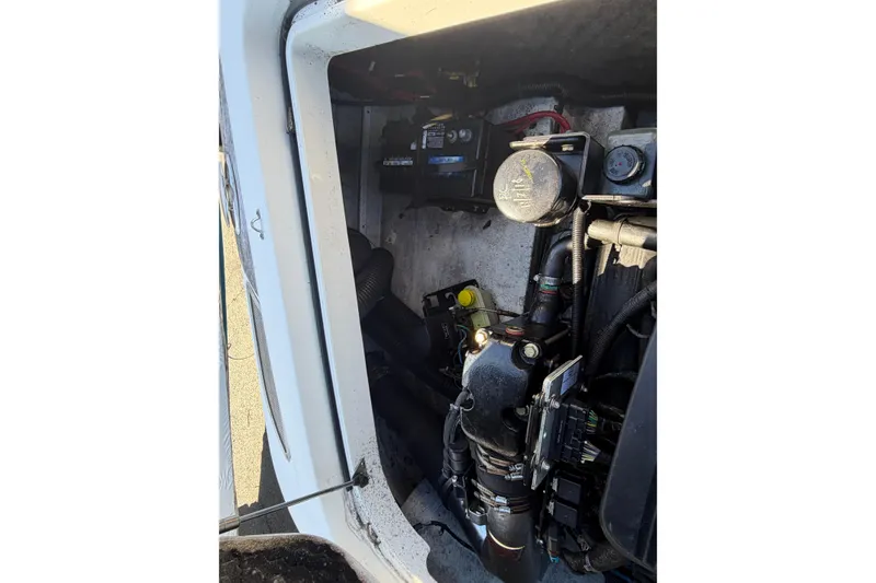 Slide: The Image of Engine compartment of a 2006 Chris-Craft Speedster boat, showing mechanical components. - 18