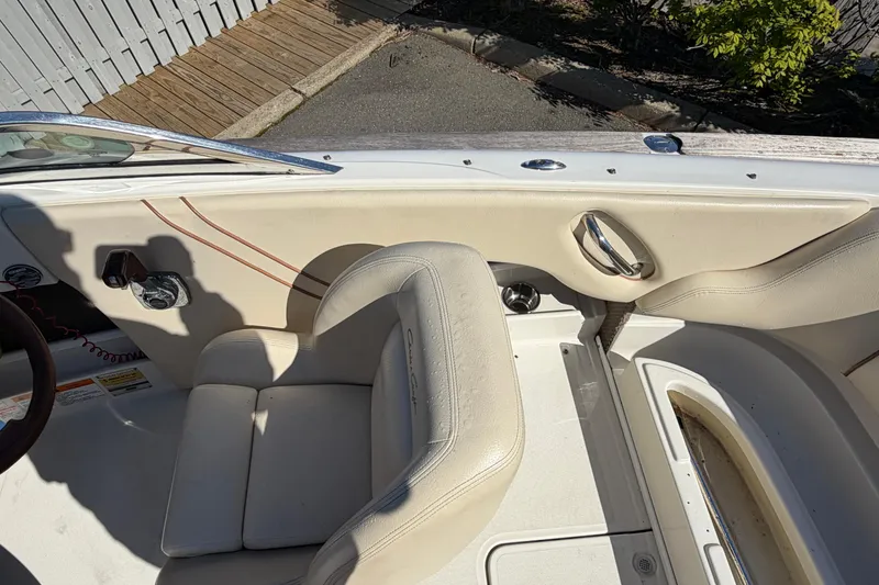 Slide: The Image of 2006 Chris-Craft Speedster interior with beige leather seats and sleek design elements. - 19