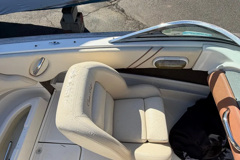 Slide: The Image of 2006 Chris-Craft Speedster boat interior with cream leather seats and chrome accents. - 21