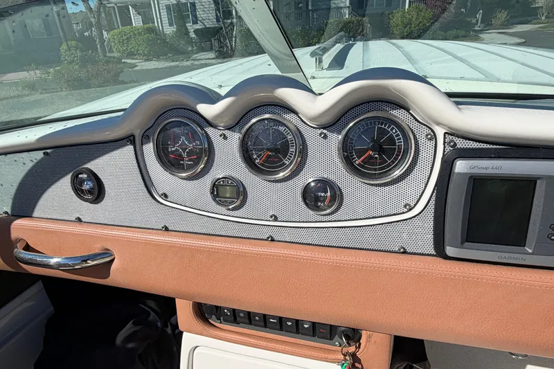 Slide: The Image of 2006 Chris-Craft Speedster dashboard with gauges and Garmin GPS system. - 26