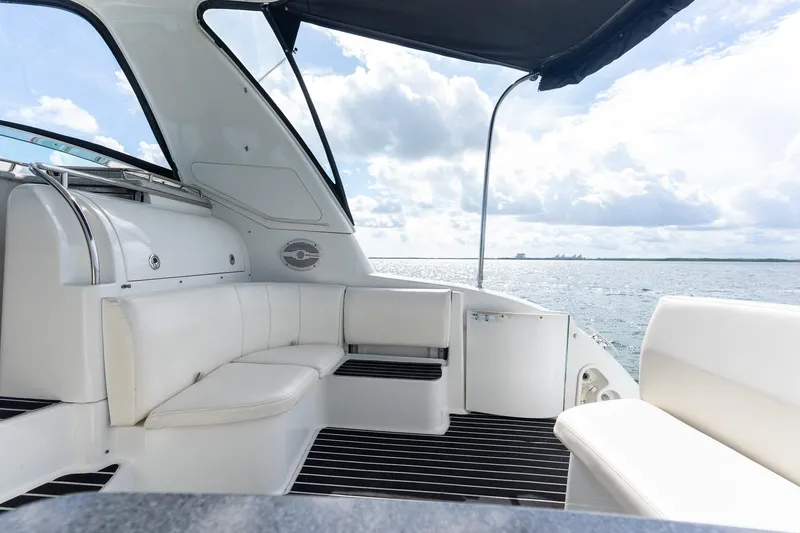 Slide: The Image of 2005 Formula 48 Yacht interior with white seating, overlooking serene ocean view. - 18