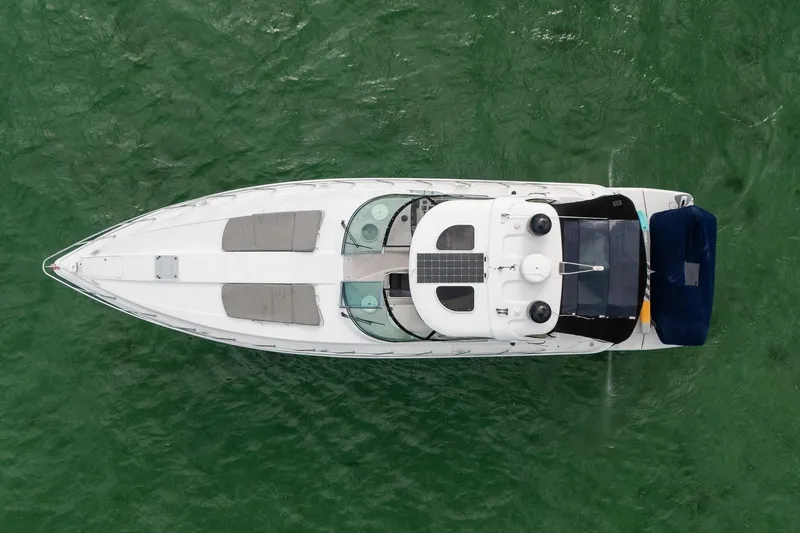 Slide: The Image of Overhead view of a 2005 Formula 48 Yacht on green water. - 2