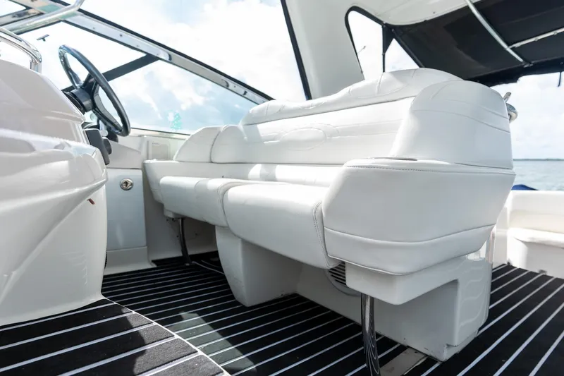 Slide: The Image of 2005 Formula 48 Yacht interior with white seating and striped flooring. - 26