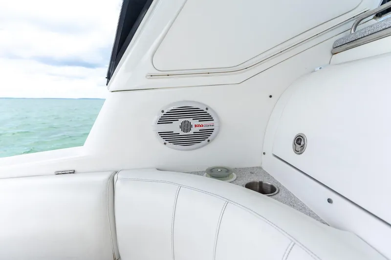 Slide: The Image of Interior of 2005 Formula 48 Yacht with speaker and seating, overlooking the ocean. - 34