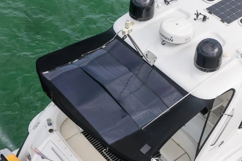 Slide: The Image of 2005 Formula 48 Yacht with solar panels on deck, cruising in green waters. - 4