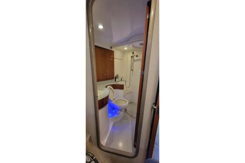 Slide: The Image of Luxurious bathroom in 2005 Formula 48 Yacht with modern fixtures and ambient lighting. - 52