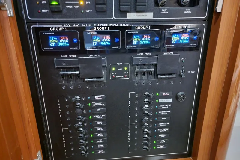 Slide: The Image of Electrical control panel of a 2005 Formula 48 Yacht with digital displays and switches. - 57