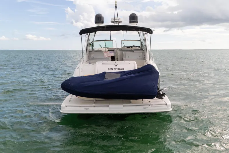 Slide: The Image of 2005 Formula 48 Yacht on water, rear view with covered equipment. - 6