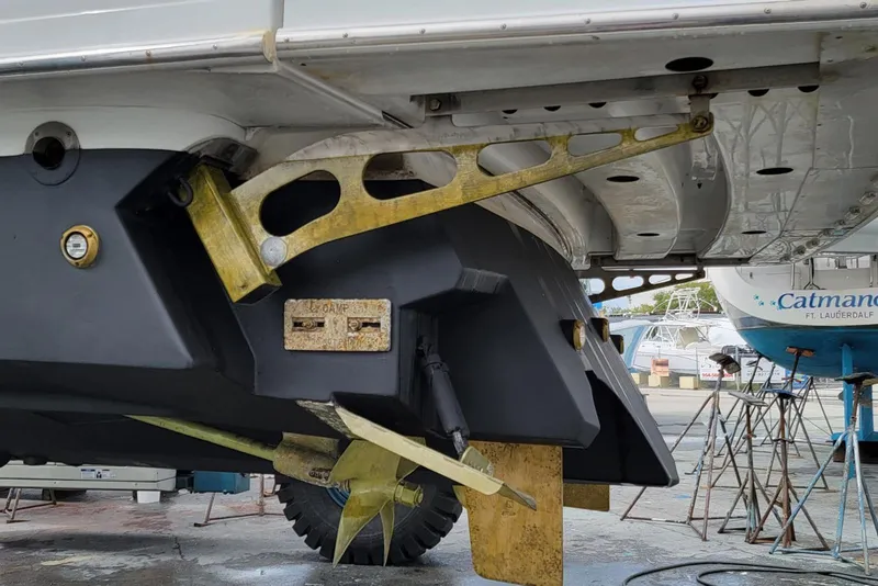 Slide: The Image of 2005 Formula 48 Yacht under maintenance, showcasing propeller and hull details. - 60