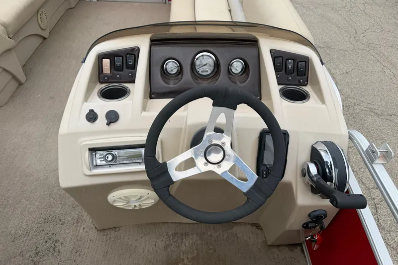 Slide: The Image of Steering console of a 2014 Bennington 21 SLX pontoon boat with controls and gauges. - 7
