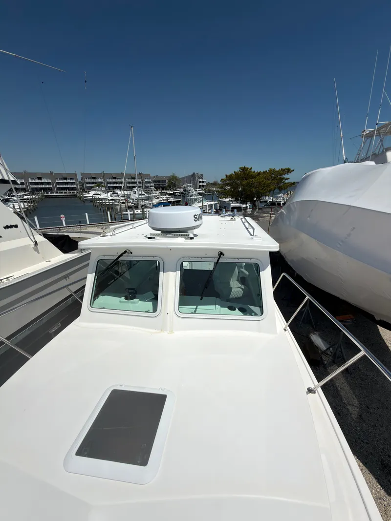 Slide: The Image of Steiger Craft 31 Fisherman 2023 on calm waters. - 6