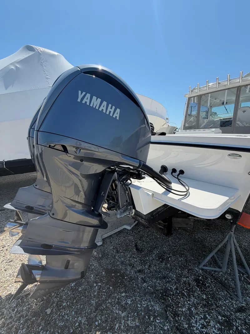 Slide: The Image of Steiger Craft 31 Fisherman 2023 on calm waters with clear cabin view. - 7
