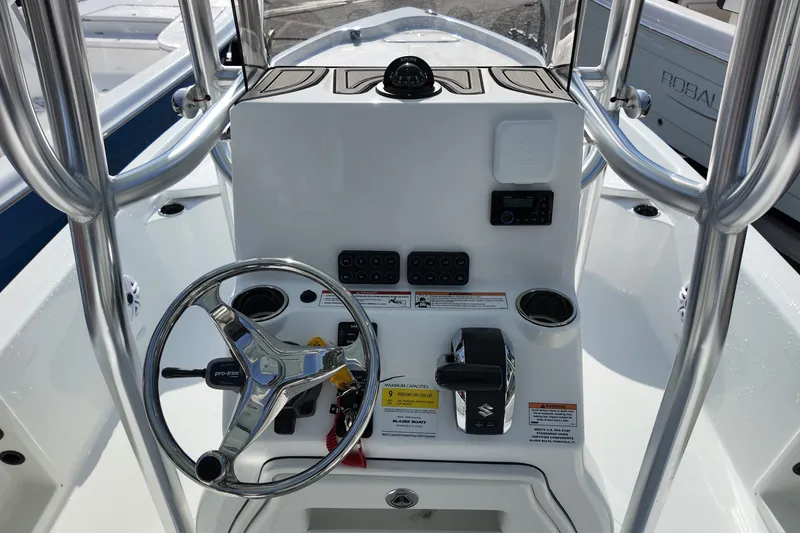 Slide: The Image of 2026 Blazer PureBay 2400 boat console with steering wheel and controls. - 6