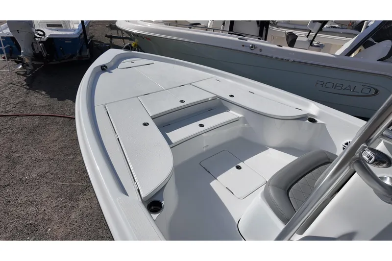 Slide: The Image of 2026 Blazer PureBay 2400 boat deck with seating and storage compartments. - 7
