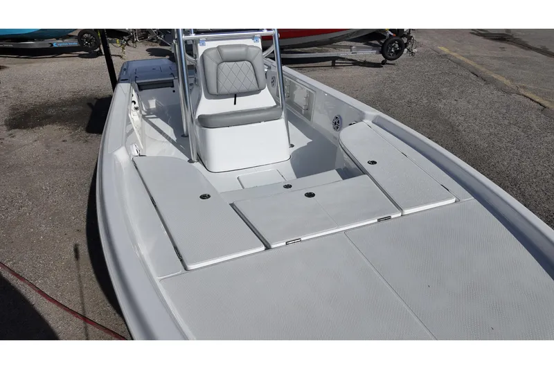 Slide: The Image of 2026 Blazer PureBay 2400 boat interior with sleek seating and storage compartments. - 8