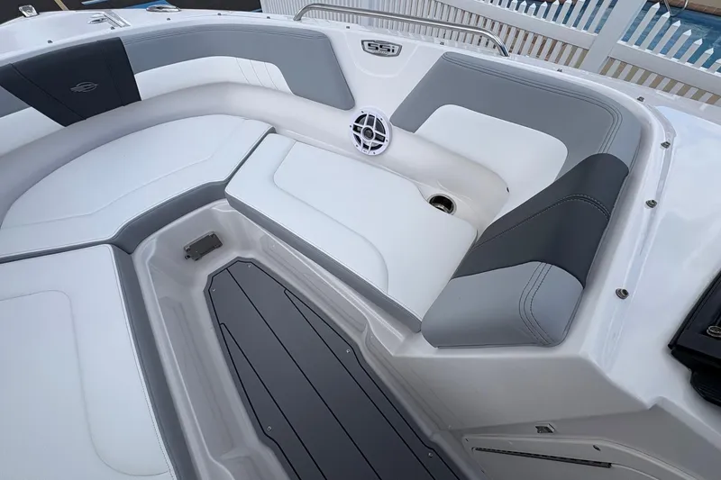 Slide: The Image of Interior view of 2026 Chaparral 23 SSi OB boat, featuring sleek seating and modern design. - 10