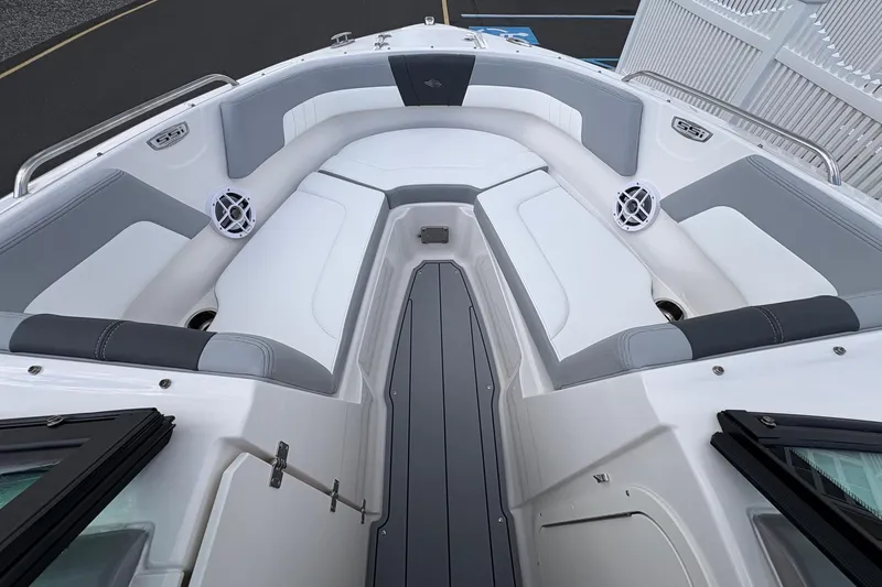 Slide: The Image of 2026 Chaparral 23 SSi OB boat interior with gray and white seating, speakers, and sleek design. - 12