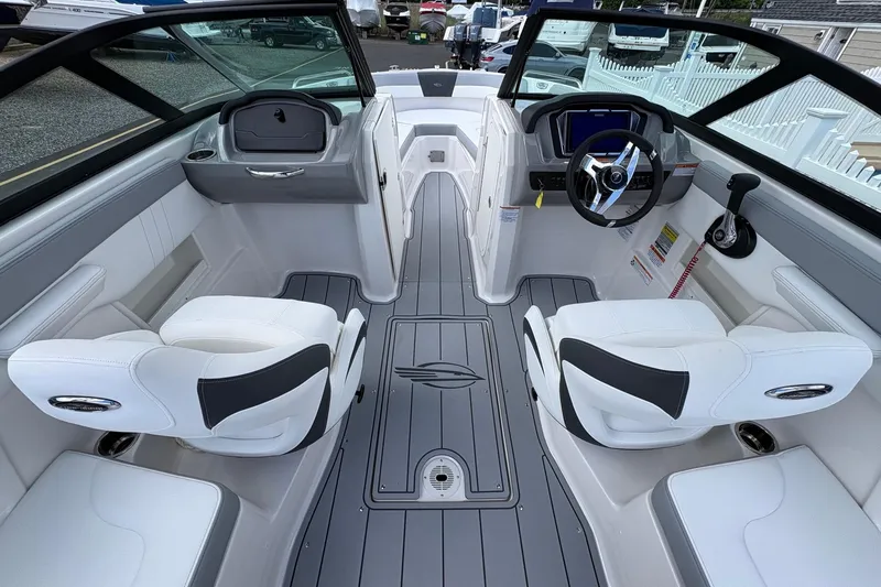 Slide: The Image of Interior of 2026 Chaparral 23 SSi OB boat with modern seating and controls. - 16