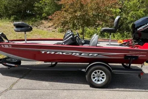 The Image of 2023 Tracker Pro Team 195 TXW Tournament Edition boat on trailer, red color, side view. - 0