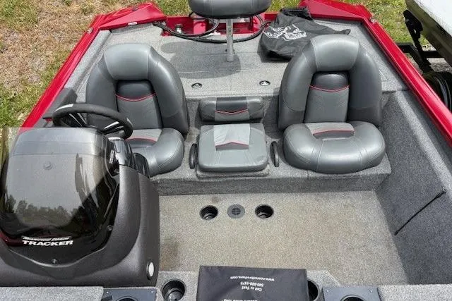 Slide: The Image of 2023 Tracker Pro Team 195 TXW Tournament Edition boat interior with gray seating and steering console. - 16