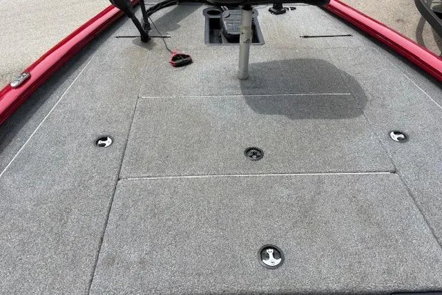 Slide: The Image of 2023 Tracker Pro Team 195 TXW Tournament Edition boat deck with gray carpeting. - 17