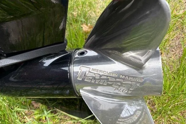 Slide: The Image of Propeller of 2023 Tracker Pro Team 195 TXW Tournament Edition boat in grass. - 23