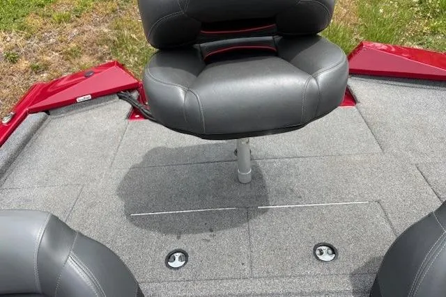 Slide: The Image of 2023 Tracker Pro Team 195 TXW Tournament Edition boat seat on gray deck. - 24