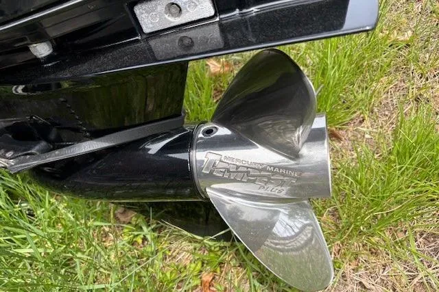Slide: The Image of Propeller of 2023 Tracker Pro Team 195 TXW Tournament Edition on grass. - 26