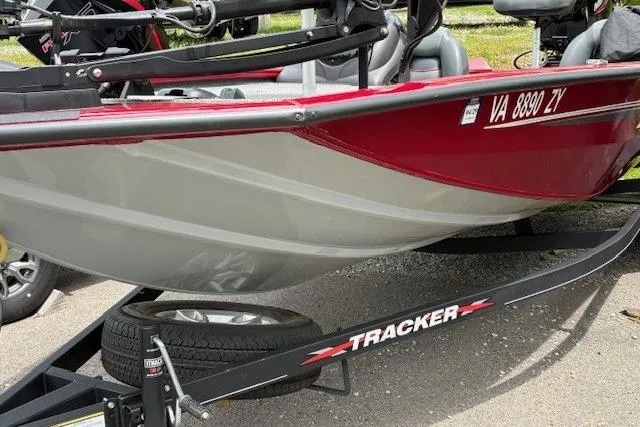 Slide: The Image of 2023 Tracker Pro Team 195 TXW Tournament Edition boat on trailer, red and gray design. - 3