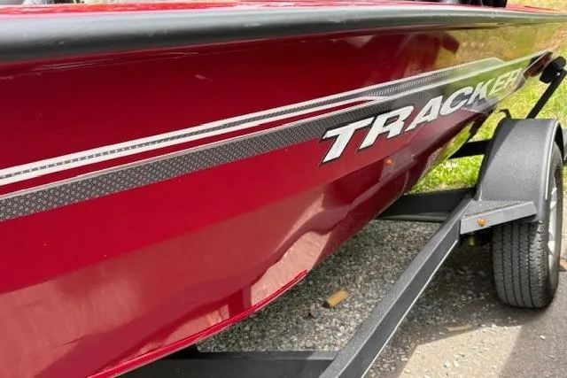 Slide: The Image of 2023 Tracker Pro Team 195 TXW Tournament Edition boat, red exterior, on trailer. - 4
