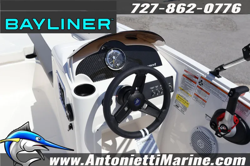 Slide: The Image of 2026 Bayliner Element E16 boat dashboard with steering wheel and controls. - 10