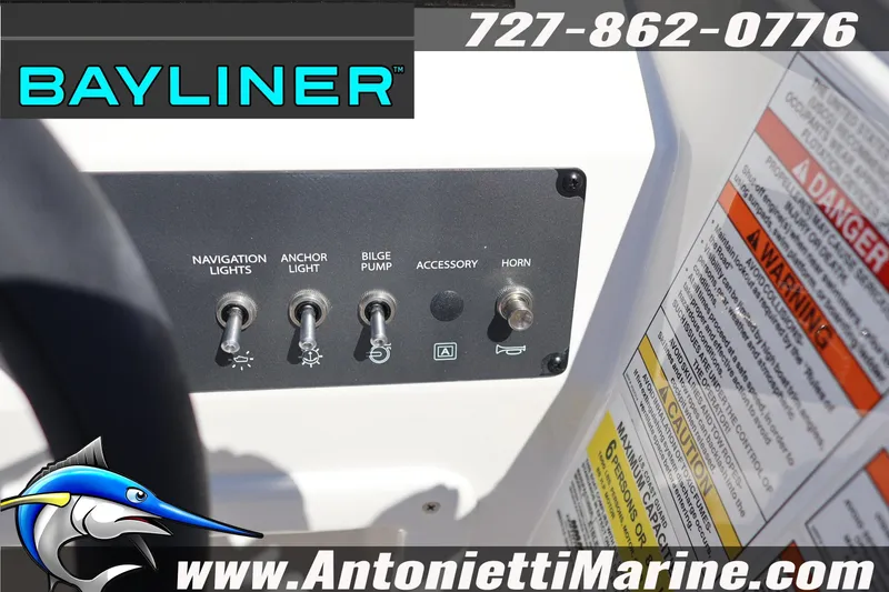 Slide: The Image of Control panel of 2026 Bayliner Element E16 boat with switches and warning labels. - 12