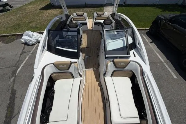 Slide: The Image of 2021 Yamaha Boats 275SD interior with spacious seating and sleek design. - 12