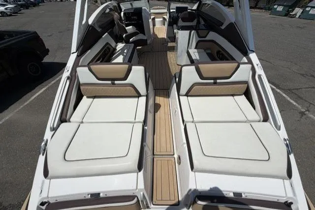 Slide: The Image of 2021 Yamaha Boats 275SD interior with spacious seating and sleek design. - 16