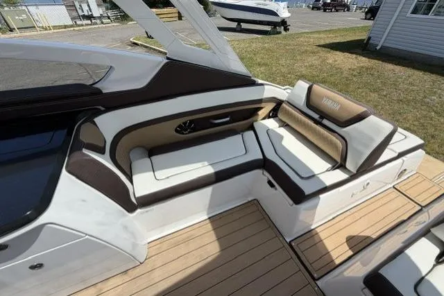 Slide: The Image of 2021 Yamaha Boats 275SD interior with luxurious seating and modern design. - 22