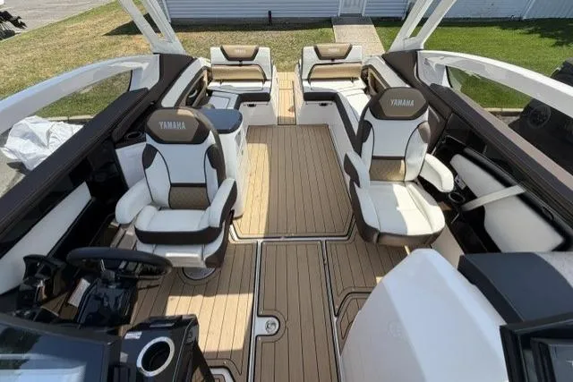 Slide: The Image of 2021 Yamaha Boats 275SD interior with luxurious seating and sleek design. - 23