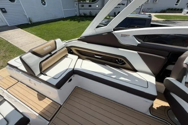 Slide: The Image of 2021 Yamaha Boats 275SD interior with luxurious seating and sleek design. - 27
