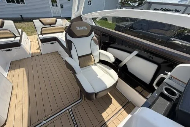 Slide: The Image of 2021 Yamaha Boats 275SD interior with luxurious seating and modern design. - 33